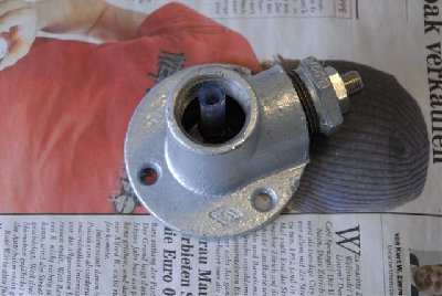 Base with check valve installed, ready for epoxy pouring.