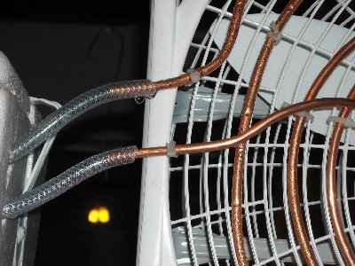 The leaky connection.  Tape would probably stop it, but I would rather get some proper fittings.  Then I can boost the pump with no worries.  You can also get a better look at the condensation here.
