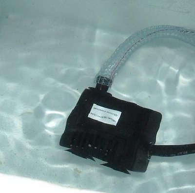 My cheap submersible pump, chugging away.