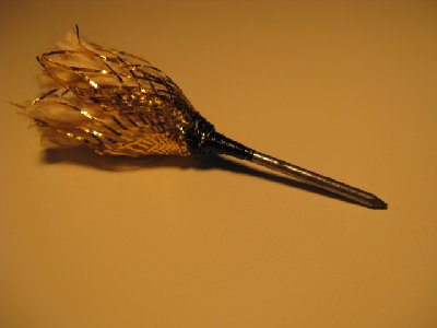 6- When everything is dry, take the dart out of the vice &amp;amp; unravel the back so it looks like this &amp;amp; your done!