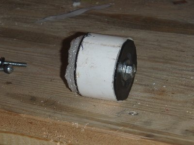 The piston w/ rubber inner tube sealing face and foam bumper.