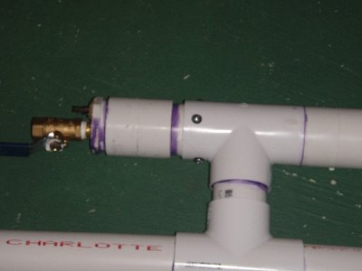 The piston housing. The piston fits only in the middle of the tee.