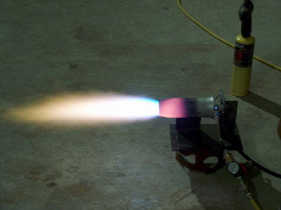 Version 2 cranked up. No fan needed for start. Quieter due to smoother airflow. Burns further down the tube where it's supposed to. Big improvement!