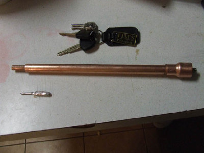 the full thing assembled...  and a nail dart next to it.  the keys are for size reference.