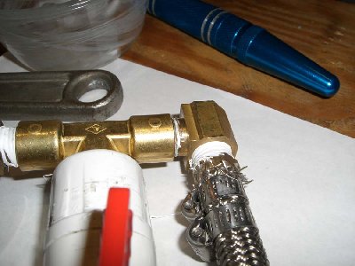 Step 17<br />wrap the elbow in teflon and thread into the tee.