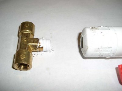 Step 10<br />Wrap the male outlet of the tee in teflon and thread into the hole you tapped