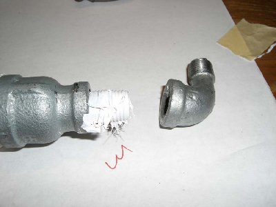 Step 7<br />wrap the nipple with teflon and thread the assembally onto the 1/4 inch street elbow