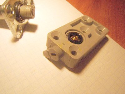 manual overide lever.... when pulled upward it tilts the small black ring (it isn't an o-ring) which rises the cylinder