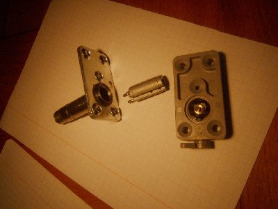 that small cylindrical thing with springs is acctually what is being pulled by the solenoid... it has rubber on the side facing the valve.... when it is lifted upwards air can pass through that small brass disk with an orfice