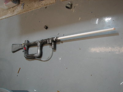 The gun with half the paint scrached off.