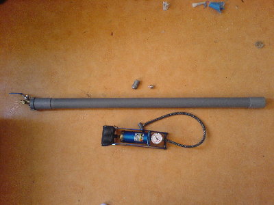 The gun along with the pump I used. I didnt have a compressor back then.<br />The outside is plain, simple and smooth. Its just one big stick with a valve on the end.