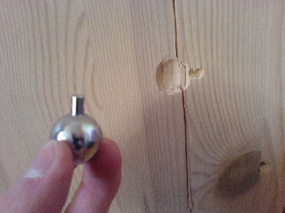 I shot this metal ball with a wadding.<br />It split the board and left a beautiful imprint.