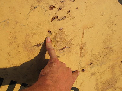 entry wounds from blowdarts... the lower hole is the one that also penetrated the barrel...