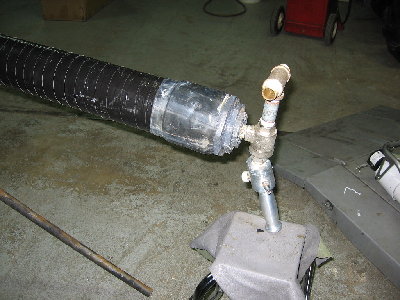 closeup of fill/pilot... when air is connected it stops here, when you squeeze the button it fills through this valve and through the qev, when you release the button it fires.