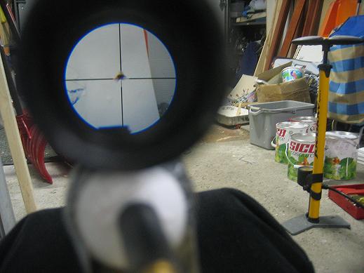 My best grouping compared to the crosshairs ( 3 paintballs went trough this hole )