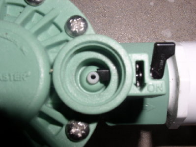 this is the white teflon piece under the solenoid that we drilled larger.