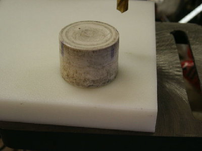 Sheet of HDPE  7/8ths inch thick.  The old original PVC pipe cap piston is sitting on it.