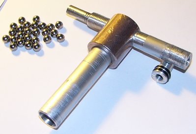 Short piece of barrel is screwed into breech tube.