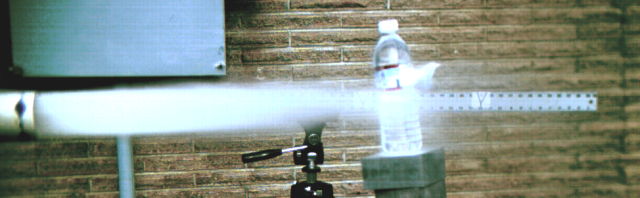 air blast prior to projectile exit.