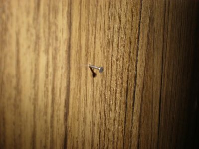not very impressive just a small nail fired at my door
