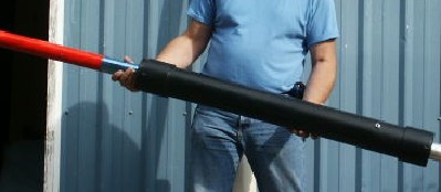 A coaxial cannon has the chamber wrapped around the barrel with the valve at the breech.