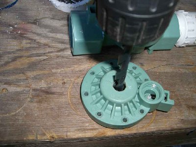 drill a 1/2 inch hole in the center of the cover