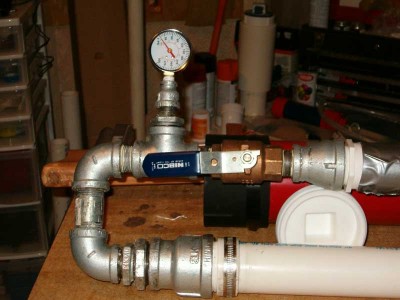 Close up of guage and ball valve.