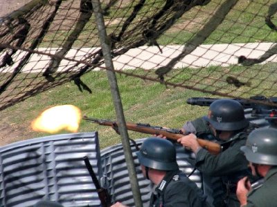 white point and black point adjusted<br /><br />The whole thing was whitish, maybe because they were popping smoke, or maybe because I was at full telephoto.