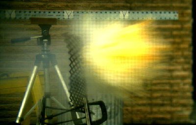 Orange filtered through an expanded metal screen at high speed.  Speed is in the 800 ft/sec range.