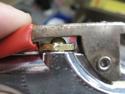 Piece of plastic glued under the handle to further depress the push button and allow for more flow