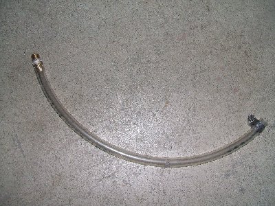 First magazine. Very simple; it's just a vinyl hose that ran from the T breech to the blowgun vent. The idea was that when the blowgun was vented, it would load one BB into the breech and the main valve would fire it. Unfortunately, the blowgun was too strong and simply blasted 10-12 BBs down the barrel, assisted by the main valve. This turned the gun into a semi automatic shotgun. Cool, but not what I wanted.