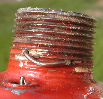 Piston retention showing some brass in the threads from brazing.