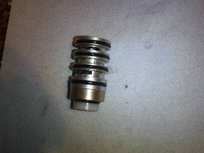 notice that it is a sort of 'two spools design'... there is outer part and the inner part... the inner spool faces the pilot side and it's pressed by air supplied to the pilot port (then it gets via a needle valve and the 'cavity')<br /><br />the outer spool doesn't move so it's there only to create a seal between the inner spool and the body of the valve