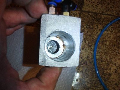 inside of the valve... the cavity that you can see at the bottom increases the time delay... there is one plugged port on it's side that can be used to increase its volume and thus time delay<br /><br />the two small holes holes at teh bottom are connected with a needle valve and a check valve (air can flow freely out  of the cavity but when it enters it flow is restricted)