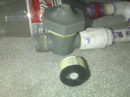 so the piston is just a standard soda bottle cap wrapped in some Teflon tape a rubber washer glued on the top, and filled with hot glue and a small end cap just for filler