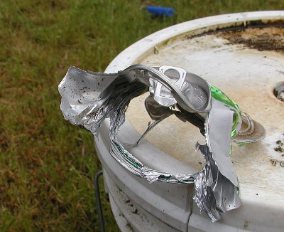 This is why it was loud.  Even with the top of the can open, it blew out the side on impact.