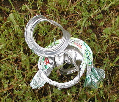 The can was found next to me.  I took a photo before touching it.  I found it unusual the center of the bottom is gone.  I did not find it.