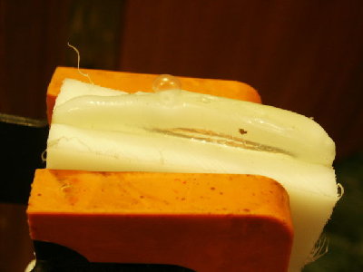 A good lamination squished out lots of liquid plastic in the process.  HDPE turns clear when melted.