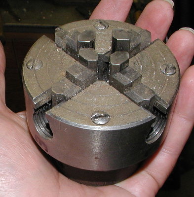 My dad's 4 jaw chuck.  Each tooth has a setscrew.