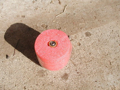 The foam and battery nests inside the water bottle bottom.