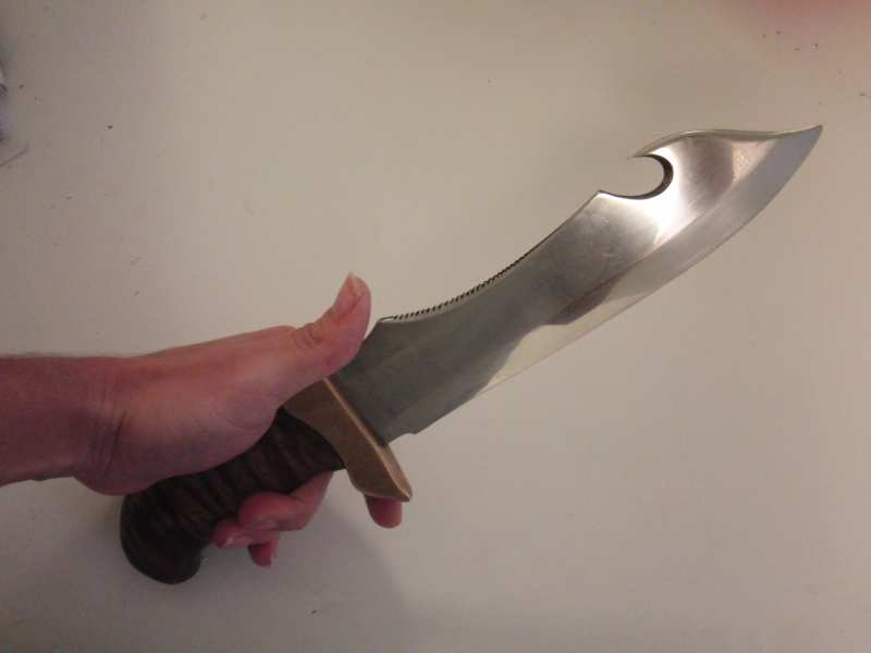 The blade is mirror polished with  1500grit sandpaper and polishing compound. Looks a bit scuffed up in the picture but in reality you can see your reflection clearly in it.