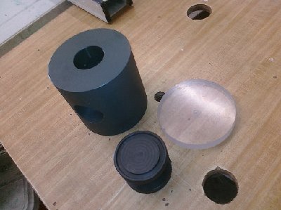 The valve cylinder, piston, and back plate.