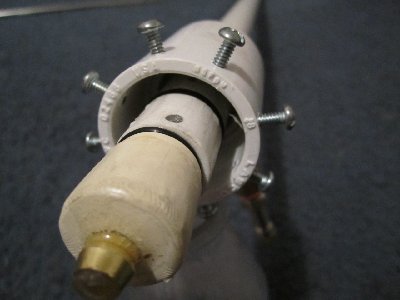 The best view of the internals I have. The o-ring which seals in the bottle neck is visible, but the porting is hidden fairly well by lighting. All it is is four 1/4&amp;quot; holes drilled around the pipe just in front of the o-ring groove. The stop screws grab the lip of the bottle and prevent the bottle from flying away at higher pressures.