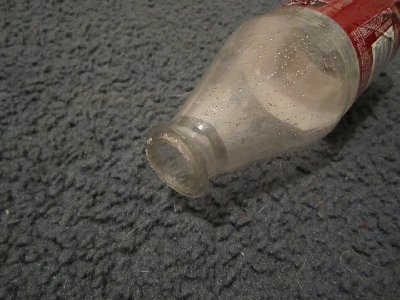 A modified Dr. Pepper bottle. This is done to allow more forward movement inside the 1&amp;quot; coupling, and therefore more flow through the porting.