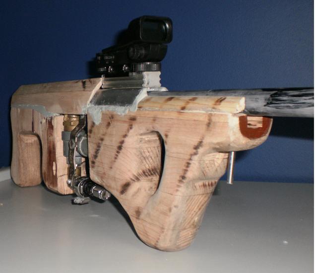 you can see the groove cut in the wood for the trigger to ride in.