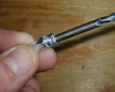 3) slide the foil out until the rod is only 1-2 times the diameter of the projectile into it, and pinch and twist the rest of the foil.