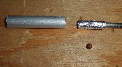 2) wrap the foil strip tightly around the rod until it's the same diameter as the inside of your barrel.  You might need to use tape to help you do this.