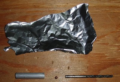 You will need:  aluminium foil, a short section of barrel material, and a rod with the same diameter as your projectile - in this case I'm using a 4.5mm drill bit for a 4.4mm steel BB.