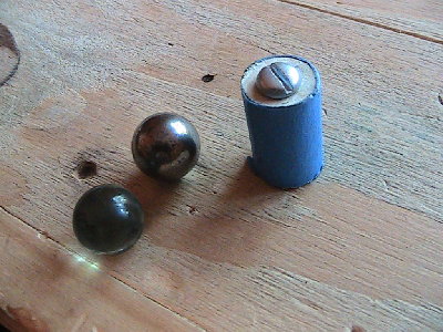 marbles steel balls or dowels wrapped in masking tape with a screw on front?