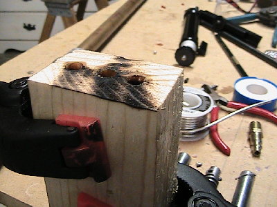 IMG_0336.JPG (243.56 KiB) Viewed 4475 times two blocks of wood with appropriate holes in them. (lube holes before use)